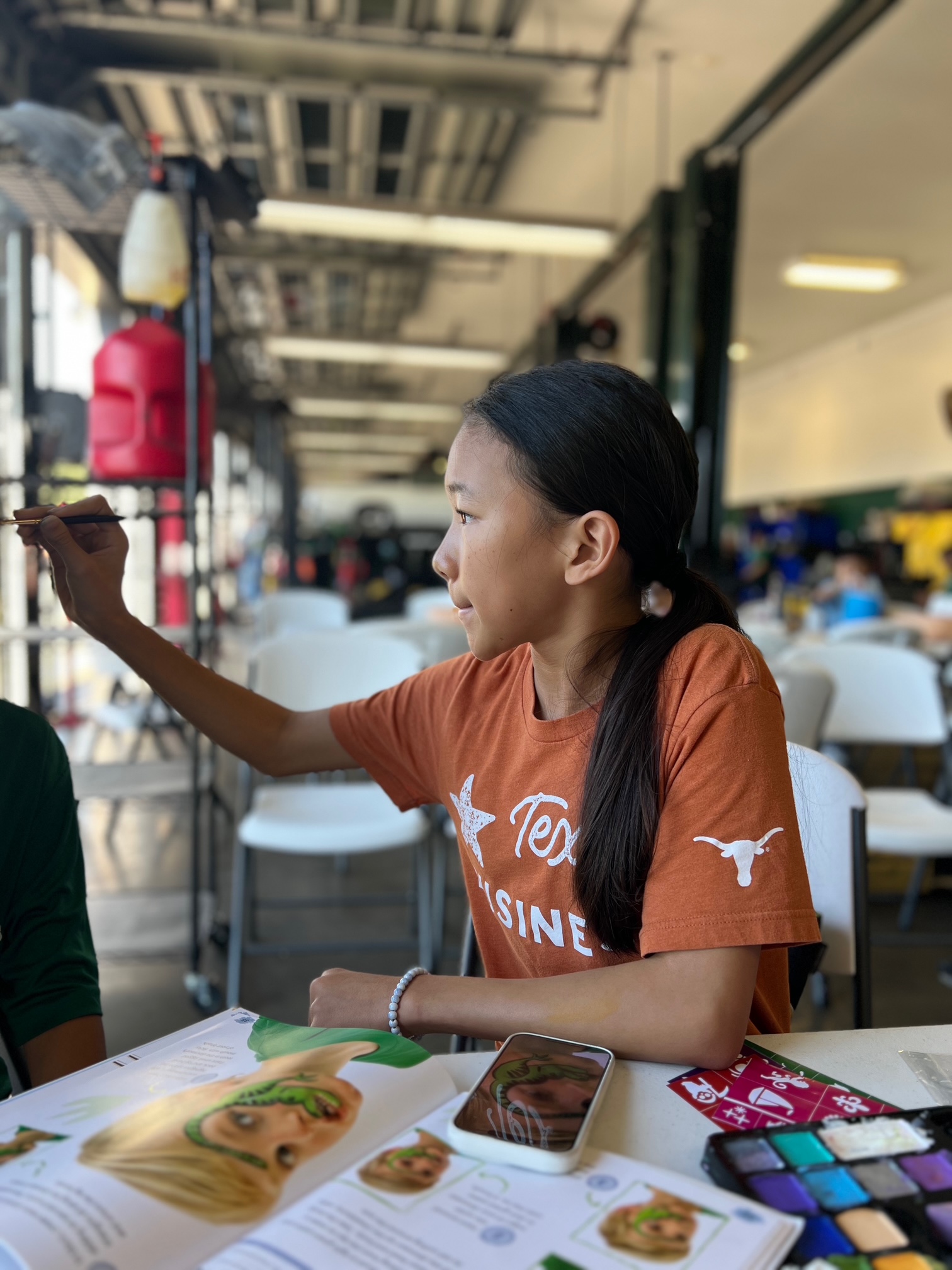 Paint Away Hunger volunteers providing face painting at National Service Day 2025 in Firethorne